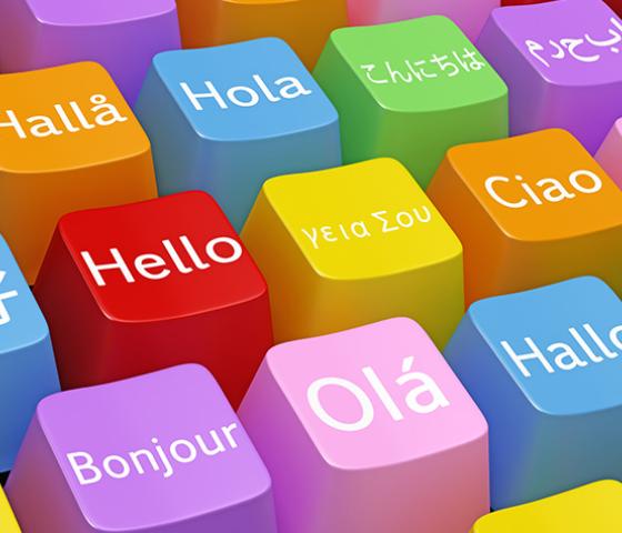 Brightly coloured keyboard keys with the word hello written in different languages