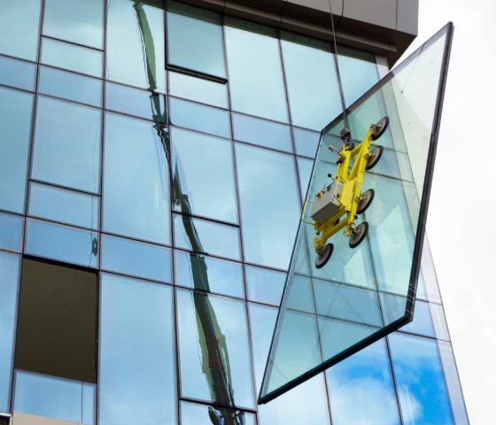 Windows, glass panel supported by crane