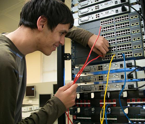 Decorative image - a person working in a server room