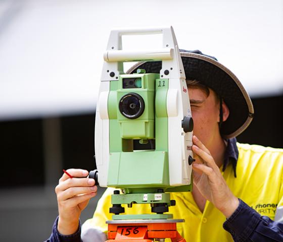 Decorative image - students using surveying equipment